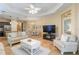 Inviting living area features ample seating and views to the dining area and kitchen at 11417 Okaloosa Dr, Venice, FL 34293