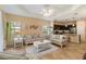 Open-concept living room offering a seamless transition to the kitchen and comfortable seating at 11417 Okaloosa Dr, Venice, FL 34293
