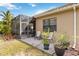 Charming screened patio with brick flooring offering a relaxing outdoor seating area at 11417 Okaloosa Dr, Venice, FL 34293