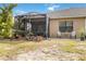 Relaxing screened patio with lush landscaping provides outdoor living and privacy at 11417 Okaloosa Dr, Venice, FL 34293