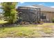 Relaxing screened patio with lush landscaping provides outdoor living and privacy at 11417 Okaloosa Dr, Venice, FL 34293