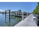 Modern boat dock featuring a boat lift, providing easy and secure access to the water at 13313 Gasparilla Rd # C501 & Slip 11, Placida, FL 33946