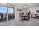Elegant dining area with a balcony overlooking the scenic water views at 13313 Gasparilla Rd # C501 & Slip 11, Placida, FL 33946