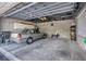 Garage with a car, room for storage and a grill at 13313 Gasparilla Rd # C501 & Slip 11, Placida, FL 33946