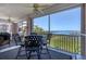 Screened lanai with comfortable seating, fan and water view at 13313 Gasparilla Rd # C501 & Slip 11, Placida, FL 33946