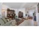 Cozy living room with comfortable seating, decorative cabinets and shelving, and stylish decor at 13313 Gasparilla Rd # C501 & Slip 11, Placida, FL 33946