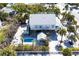 Charming coastal home featuring a private pool, covered outdoor area, lush landscaping, and a serene neighborhood at 14 Palm Dr, Placida, FL 33946
