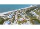 An aerial view of a charming coastal community with beach access and serene waterways at 14 Palm Dr, Placida, FL 33946