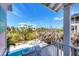 Outdoor living featuring lush greenery, a pool and neighboring residence at 14 Palm Dr, Placida, FL 33946