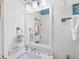 Bathroom featuring light fixture, sink, towels, beadboard and white color palette at 14 Palm Dr, Placida, FL 33946