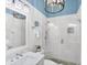 Modern bathroom with blue ceilings, a frameless shower, marble vanity, and pendant lighting at 14 Palm Dr, Placida, FL 33946