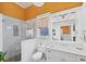 Bright bathroom features a glass shower, toilet, and vanity with natural light from the window at 14 Palm Dr, Placida, FL 33946