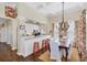 Open-concept dining area with counter seating and a dining table, great for entertaining guests at 14 Palm Dr, Placida, FL 33946