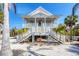 Lovely elevated beach house with double staircases, perfect for beachside living at 14 Palm Dr, Placida, FL 33946
