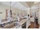 Open-concept kitchen with stone countertops, stainless steel dishwasher, and adjacent dining area at 14 Palm Dr, Placida, FL 33946
