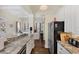 Spacious kitchen with an open layout to the living room, featuring stone countertops and stainless appliances at 14 Palm Dr, Placida, FL 33946