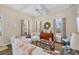 Bright living room with tray ceilings, hardwood floors, and coastal decor at 14 Palm Dr, Placida, FL 33946