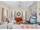 Bright living room with tray ceilings, hardwood floors, and coastal decor at 14 Palm Dr, Placida, FL 33946