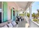 Inviting covered porch with comfortable seating and stylish décor at 14 Palm Dr, Placida, FL 33946
