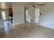 Open-concept living space with tiled flooring, neutral walls, and easy access to the kitchen at 1417 Terry Ave, Punta Gorda, FL 33980