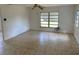 Spacious living room with tiled flooring, natural light, and a comfortable, airy ambiance at 1417 Terry Ave, Punta Gorda, FL 33980