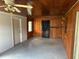 Adaptable space with a wood-paneled wall, wooden ceiling, and minimalist design elements at 1417 Terry Ave, Punta Gorda, FL 33980