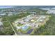 Scenic aerial view of a vibrant community with lush greenery and glistening lakes at 14281 Palm Ter, Port Charlotte, FL 33953
