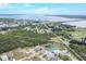 Expansive aerial view showcases the neighborhood's proximity to the water and lush green spaces at 14281 Palm Ter, Port Charlotte, FL 33953