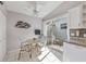 Bright breakfast nook with sliding door to the outdoor patio, adjacent to kitchen at 14281 Palm Ter, Port Charlotte, FL 33953