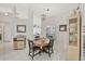 Cozy dining area with chandelier lighting and direct view into the adjacent kitchen at 14281 Palm Ter, Port Charlotte, FL 33953