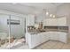 Well-equipped kitchen with white cabinets, granite countertops, and stainless steel appliances at 14281 Palm Ter, Port Charlotte, FL 33953