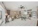 Open-concept living area with tile flooring, stylish furnishings, and ample natural light at 14281 Palm Ter, Port Charlotte, FL 33953