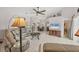 Spacious living room with neutral decor, tile flooring, and a view into the dining area at 14281 Palm Ter, Port Charlotte, FL 33953