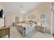 Relaxing main bedroom with ceiling fan, natural lighting, and quaint decor at 14281 Palm Ter, Port Charlotte, FL 33953