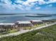 Beautiful waterfront condo complex with palm trees, beach access, and tranquil ocean views at 1651 Beach Rd # 311, Englewood, FL 34223