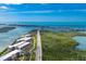 Aerial view of building, showcasing its location amidst lush greenery and coastal beauty at 1651 Beach Rd # 311, Englewood, FL 34223