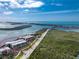 Waterfront condo complex features lush greenery, beach access, and spectacular ocean views at 1651 Beach Rd # 311, Englewood, FL 34223