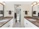 Bathroom boasts dual sinks with granite counters and a separate toilet room with stand-up shower at 1651 Beach Rd # 311, Englewood, FL 34223
