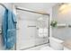 Modern bathroom features glass-enclosed shower/tub, elegant fixtures, and sleek design at 1651 Beach Rd # 311, Englewood, FL 34223