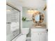 Well-lit bathroom boasts granite counters, decorative mirror and stylish fixtures at 1651 Beach Rd # 311, Englewood, FL 34223