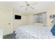 Bedroom with ceiling fan and bright white walls at 1651 Beach Rd # 311, Englewood, FL 34223