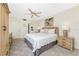This bedroom features neutral walls, a ceiling fan, and carpeted floors at 1651 Beach Rd # 311, Englewood, FL 34223