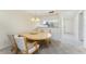 Dining area with table and chairs, located adjacent to the kitchen and entrance hall at 1651 Beach Rd # 311, Englewood, FL 34223