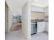 Beautiful partial kitchen view showcasing stainless appliances and the adjacent living space at 1651 Beach Rd # 311, Englewood, FL 34223