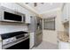 This kitchen features stainless appliances, granite countertops, and lots of natural light at 1651 Beach Rd # 311, Englewood, FL 34223