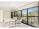 Inviting lanai features comfortable seating and panoramic views, perfect for relaxation at 1651 Beach Rd # 311, Englewood, FL 34223