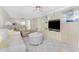 Inviting living space with comfortable furniture and a view to the dining and kitchen areas at 1651 Beach Rd # 311, Englewood, FL 34223