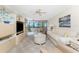 Comfortable living room featuring stylish furnishings, bright windows, and serene waterfront views at 1651 Beach Rd # 311, Englewood, FL 34223