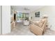 Cozy living room featuring comfortable seating and views of the outside scenery at 1651 Beach Rd # 311, Englewood, FL 34223