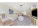 Spacious living room features comfortable seating, natural light and sleek entertainment center at 1651 Beach Rd # 311, Englewood, FL 34223